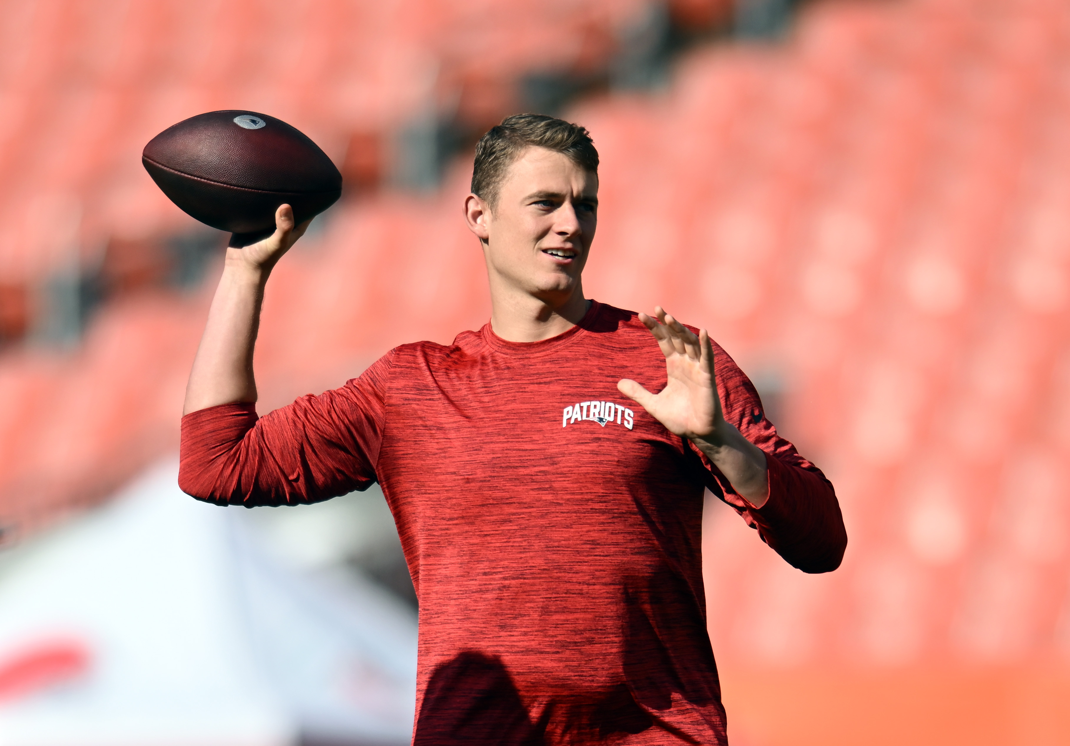 Mac Jones of the New England Patriots warms up before his game against the Cleveland Browns.