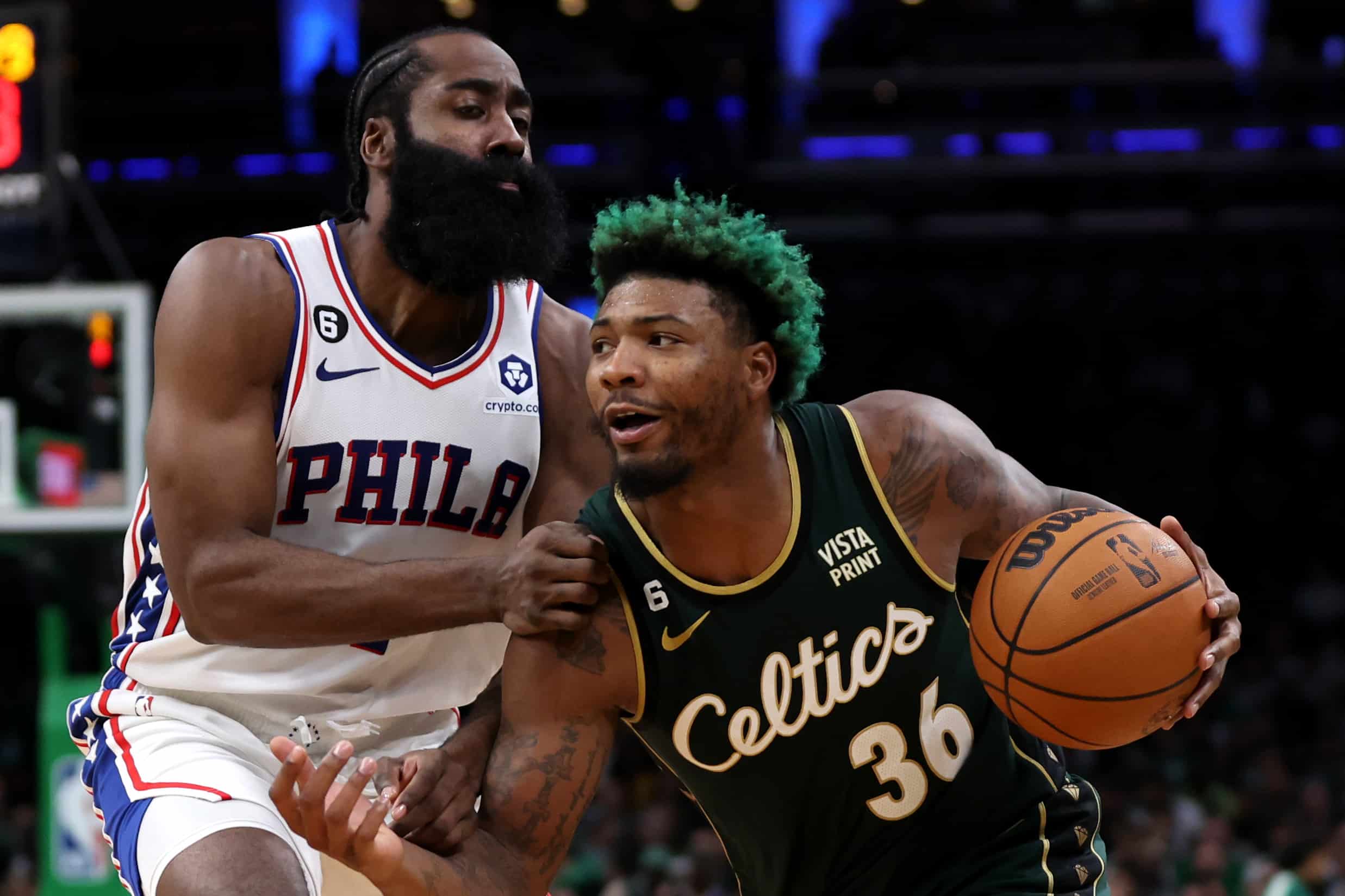 Marcus Smart of the Boston Celtics drives towards the basket against James Harden of the Philadelphia 76ers.