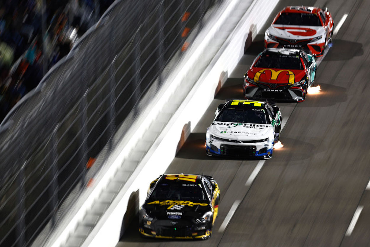Four cars battle down the stretch at Martinsville Speedway.