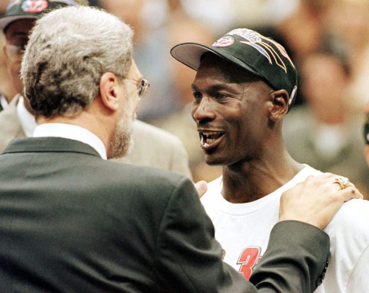 Michael Jordan (R) and Chicago Bulls head coach Phil Jackson (L) exchange words during their time with the Chicago Bulls.