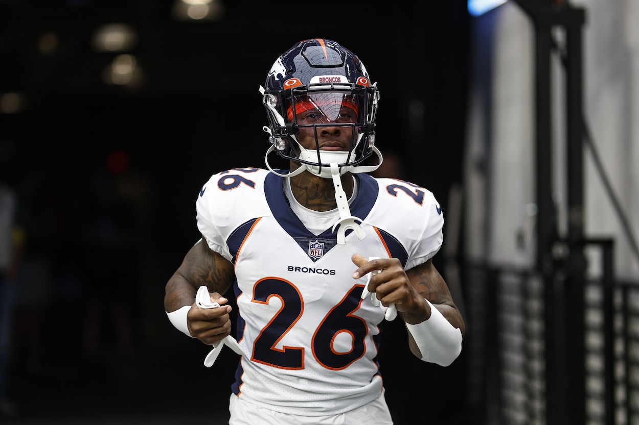 Mike Boone runs onto the field before a game.