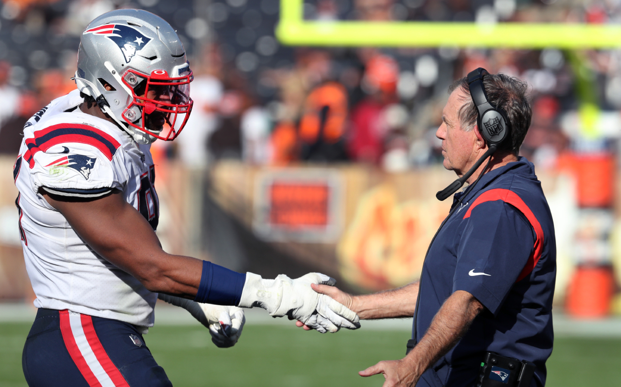 New England Patriots head coach Bill Belichick shakes hands with DL Deatrich Wise, Jr.