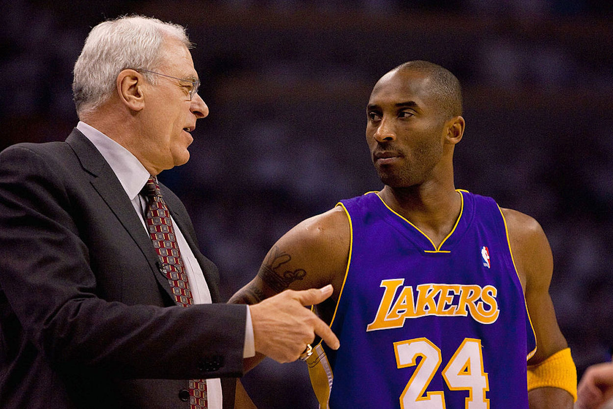 Lakers coach Phil Jackson (L) exchanges words with Kobe Byant.