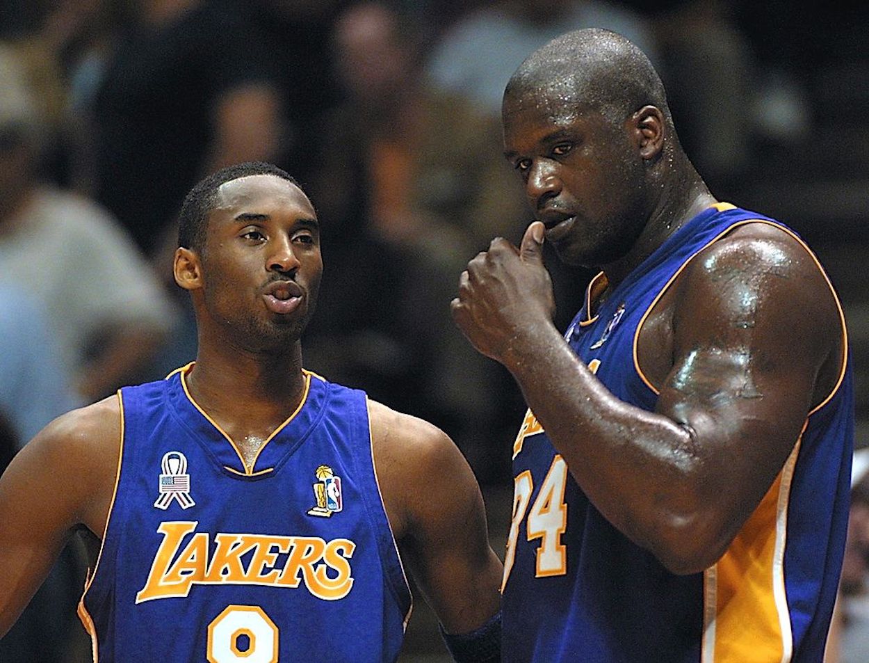 Kobe Bryant (L) and Shaquille O'Neal (R) talk during their time as Lakers teammates.