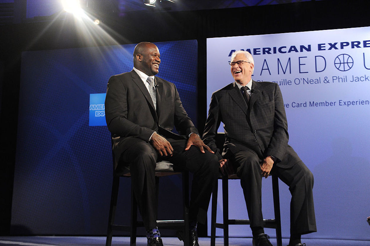 Shaquille O'Neal (L) and Phil Jackson (R) sit together at a 2016 event.