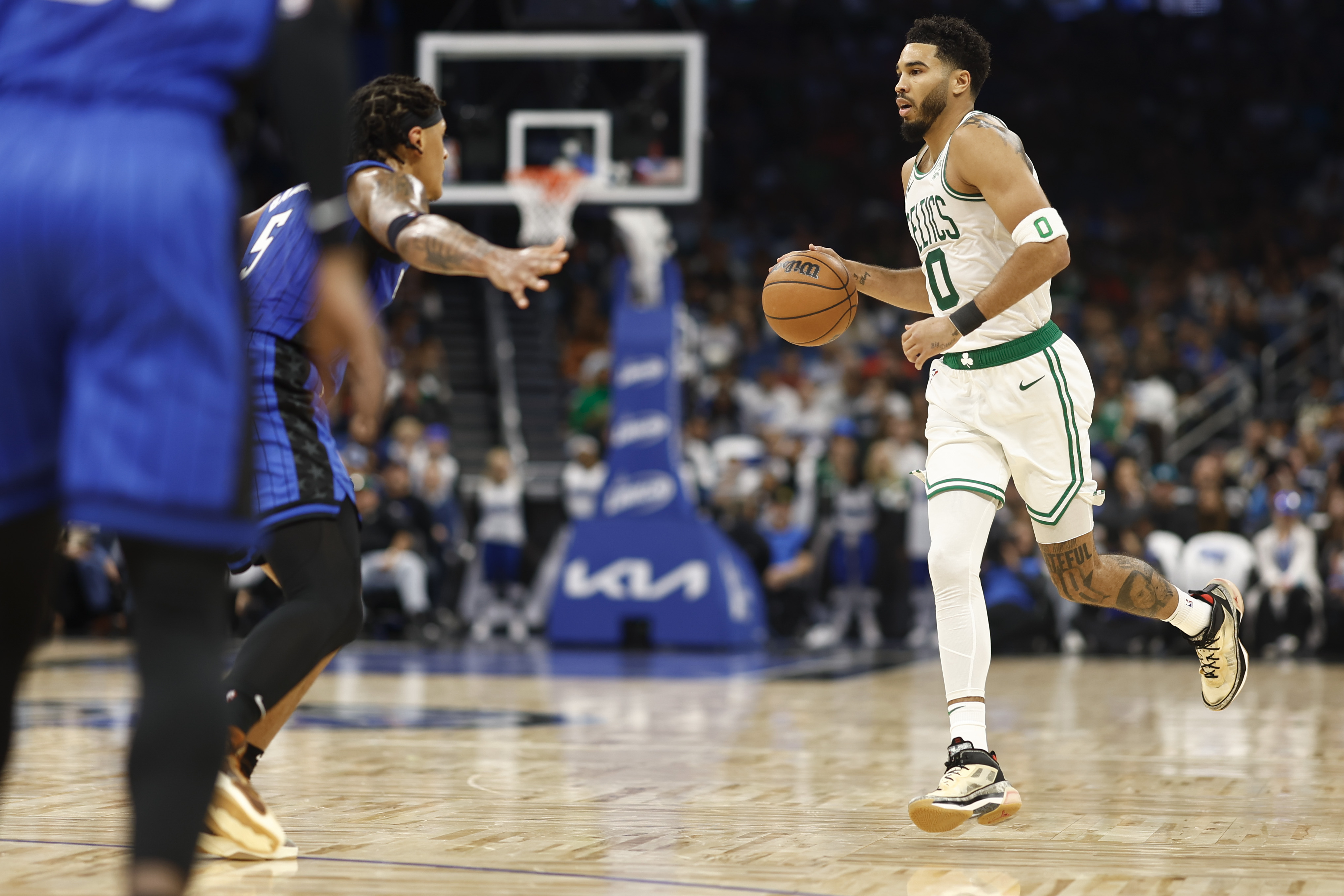 Jayson Tatum of the Boston Celtics handles the ball.