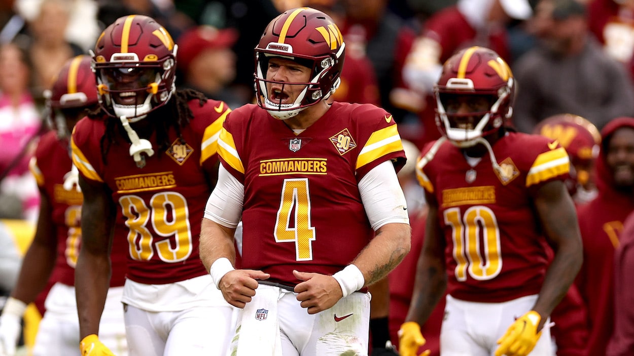 Taylor Heinicke of the Washington Commanders celebrates.