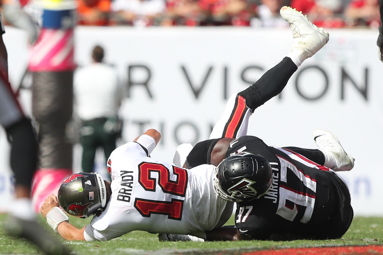 Tom Brady gets tackled by Grady Jarrett during a Buccaneers-Falcons matchup in October 2022