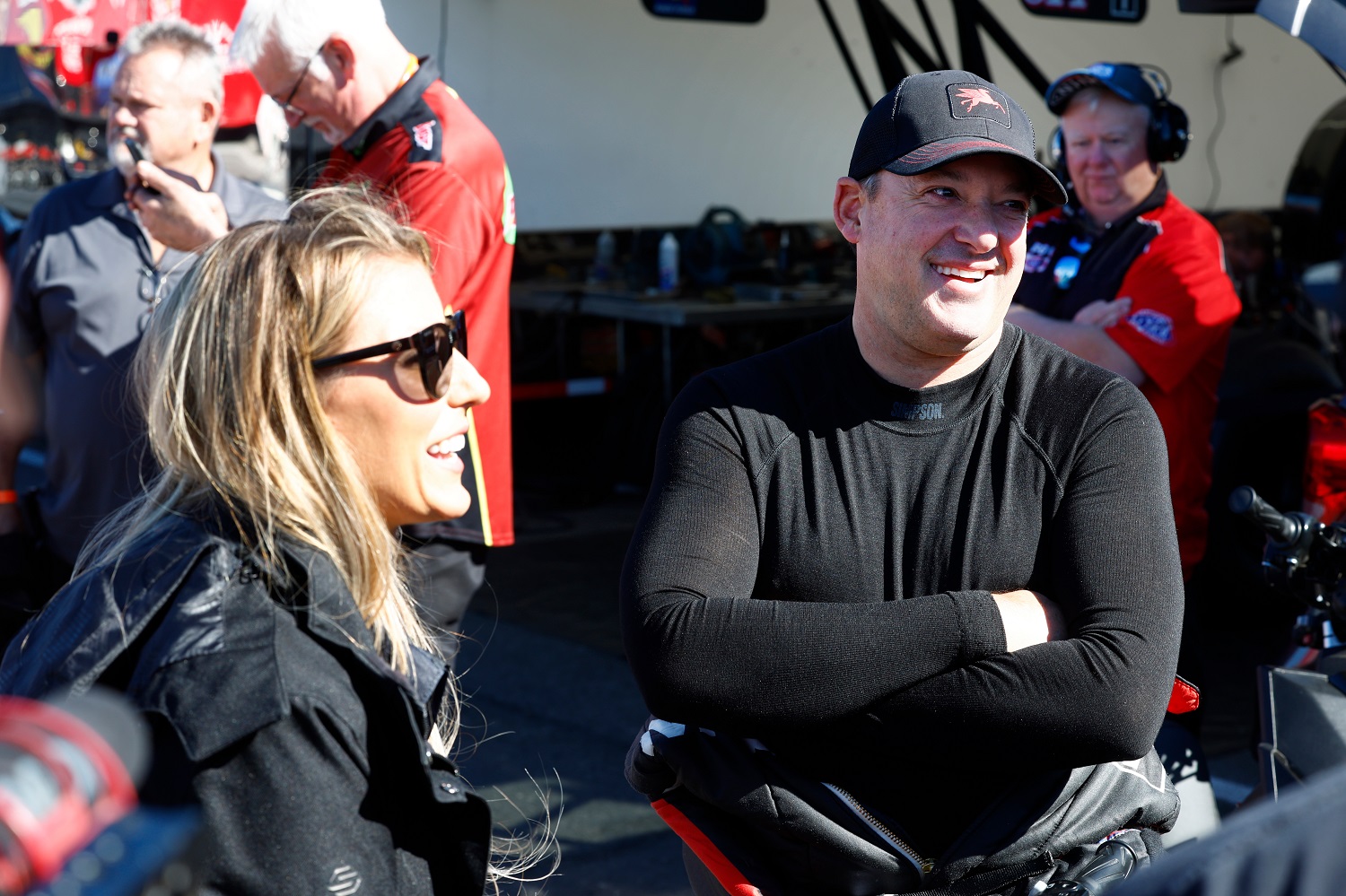 Tony Stewart talks with fans and his wife, Leah Pruett, during the NHRA Nevada Nationals on Oct. 28, 2022, at The Strip at Las Vegas Motor Speedway. | Jeff Speer/LVMS/Icon Sportswire via Getty Images