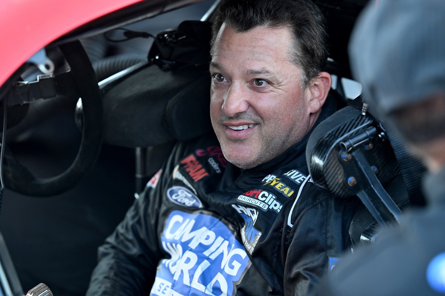 Tony Stewart talks with his crew prior to the SRX qualifying race at Sharon Speedway on July 23, 2022 in Hartford, Ohio.