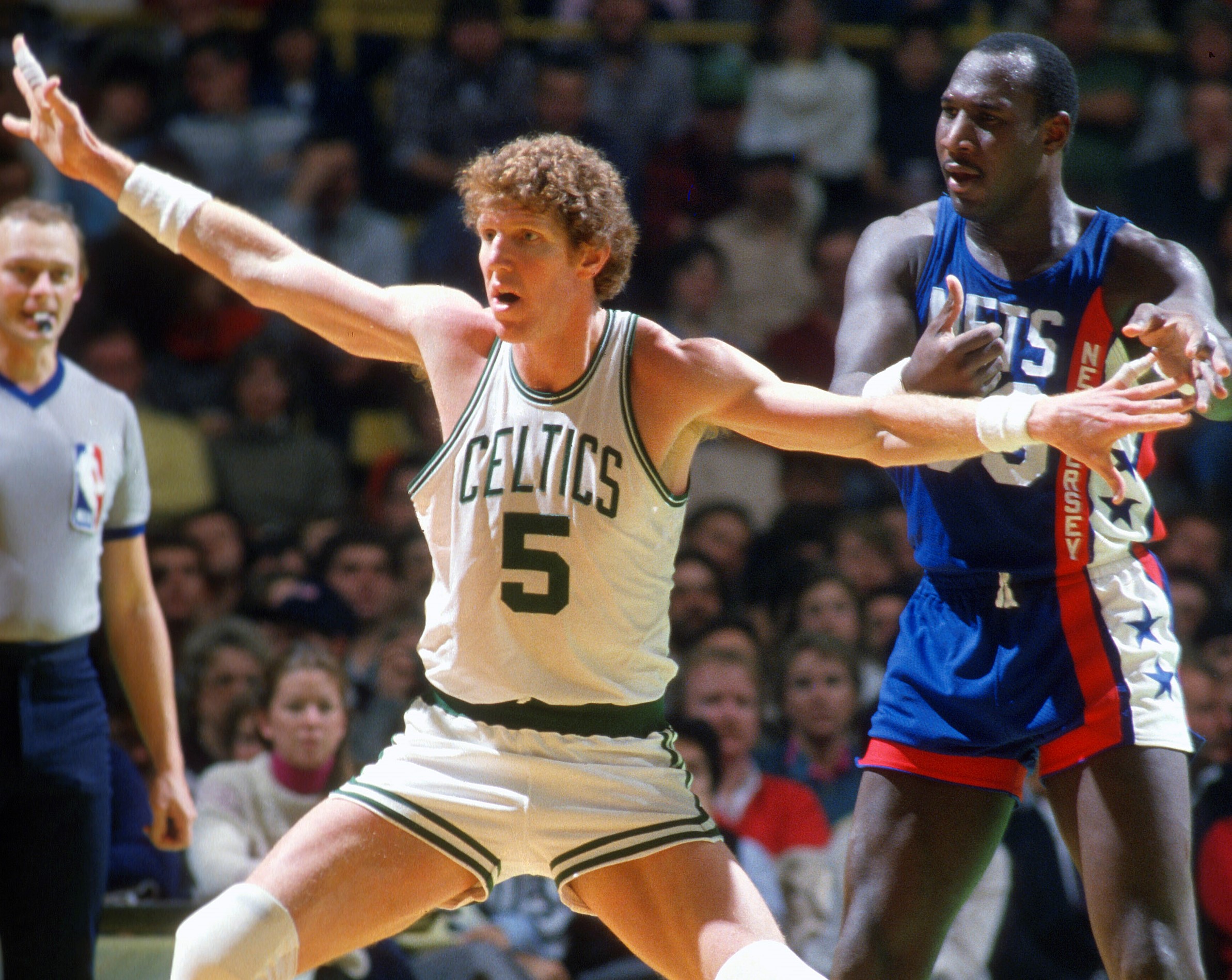 Bill Walton of the Boston Celtics gets position on Darryl Dawkins of the New Jersey Nets.