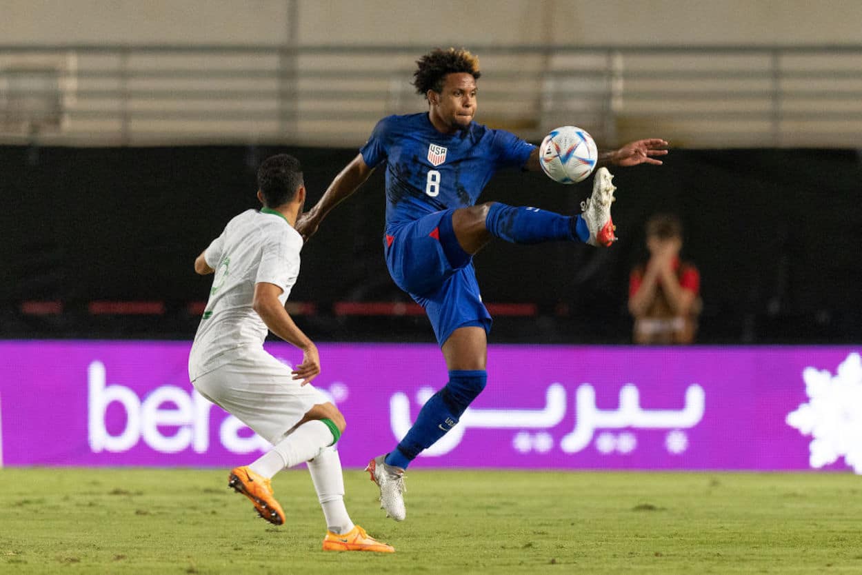 Weston Mckennie (R) controls the ball during a USMNT match.