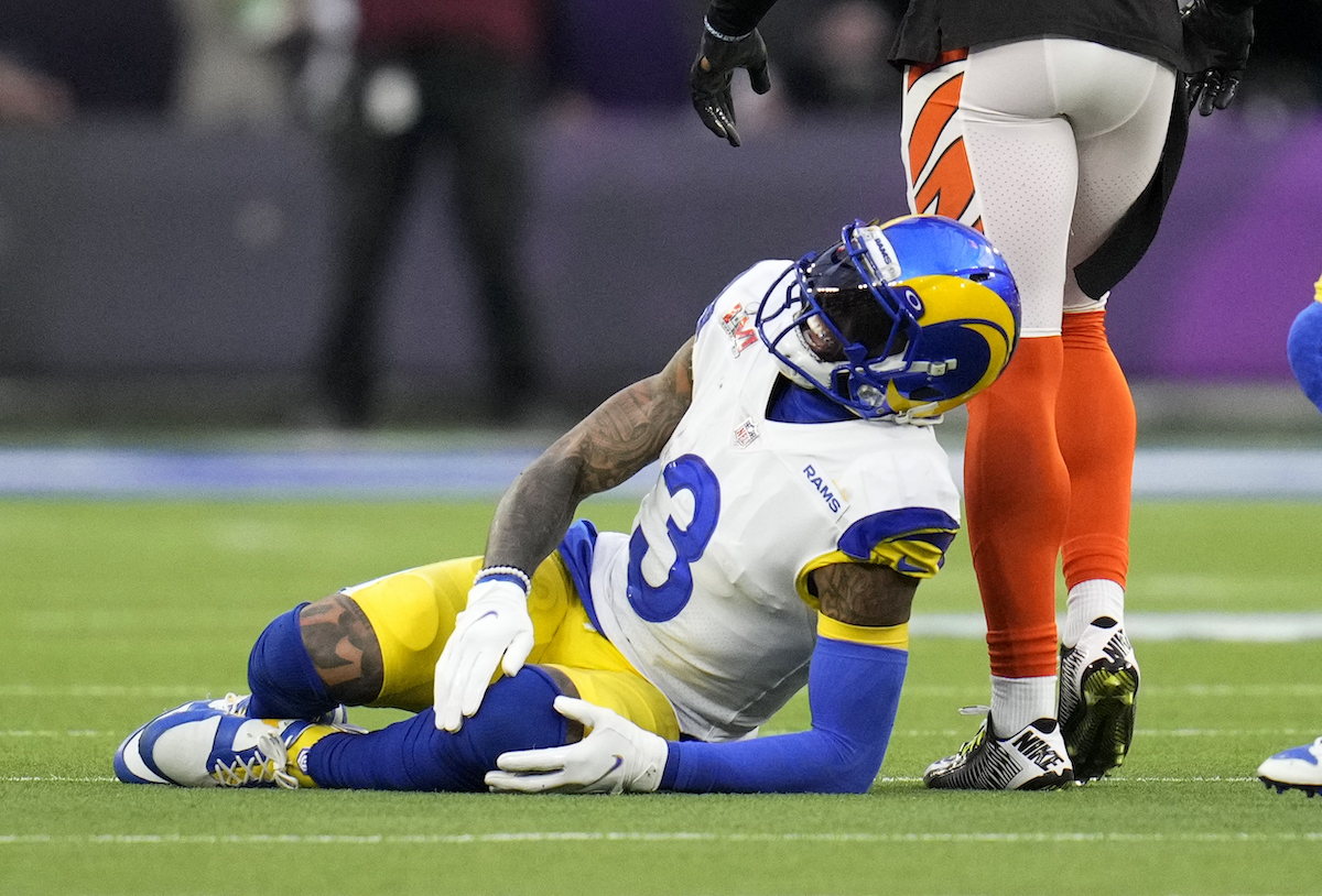 Wide receiver Odell Beckham Jr. of the Los Angeles Rams reacts after an injury during Super Bowl LVI