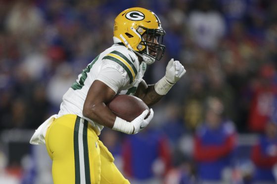 AJ Dillon runs the ball against the Bills.