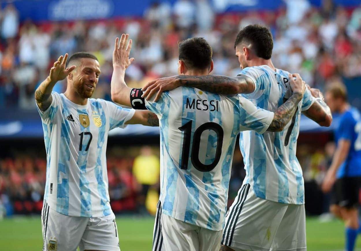 Lionel Messi celebrates a goal with his Argentina teammates.