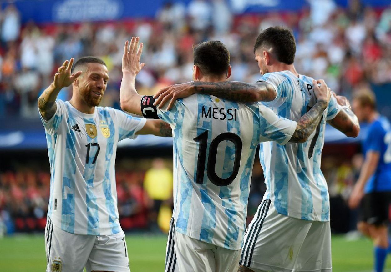 Lionel Messi celebrates a goal with his Argentina teammates.