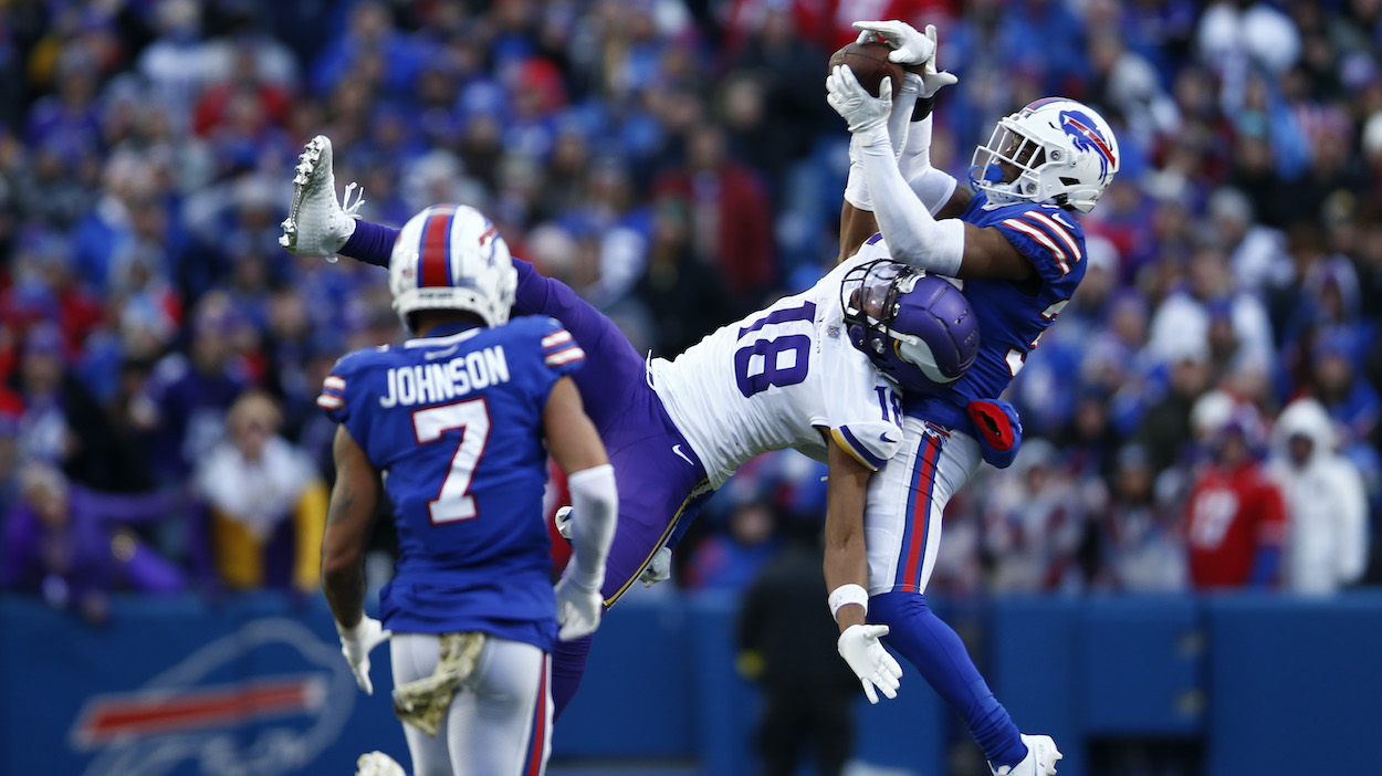 Justin Jefferson of the Minnesota Vikings catches a pass in front of Cam Lewis of the Buffalo Bills.