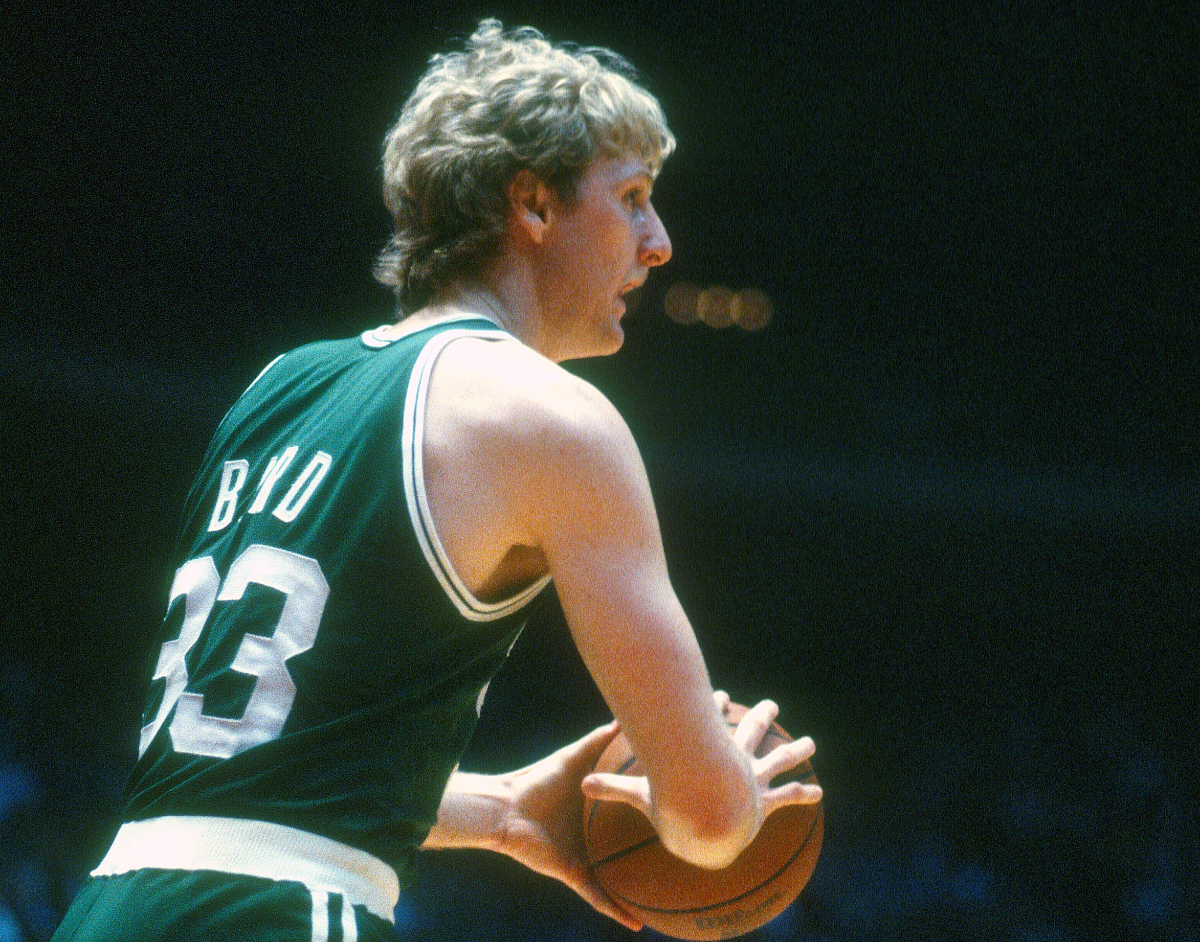 Larry Bird of the Boston Celtics looks to shoot against the Houston Rockets.