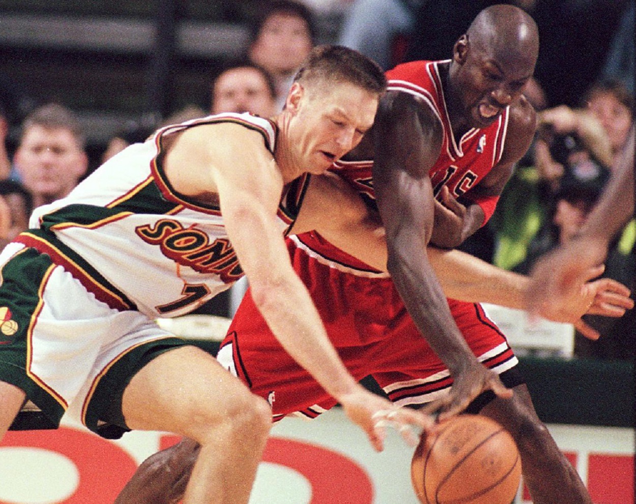 Michael Jordan and Detlef Schrempf battle during a Bulls-Sonics matchup in November 1997