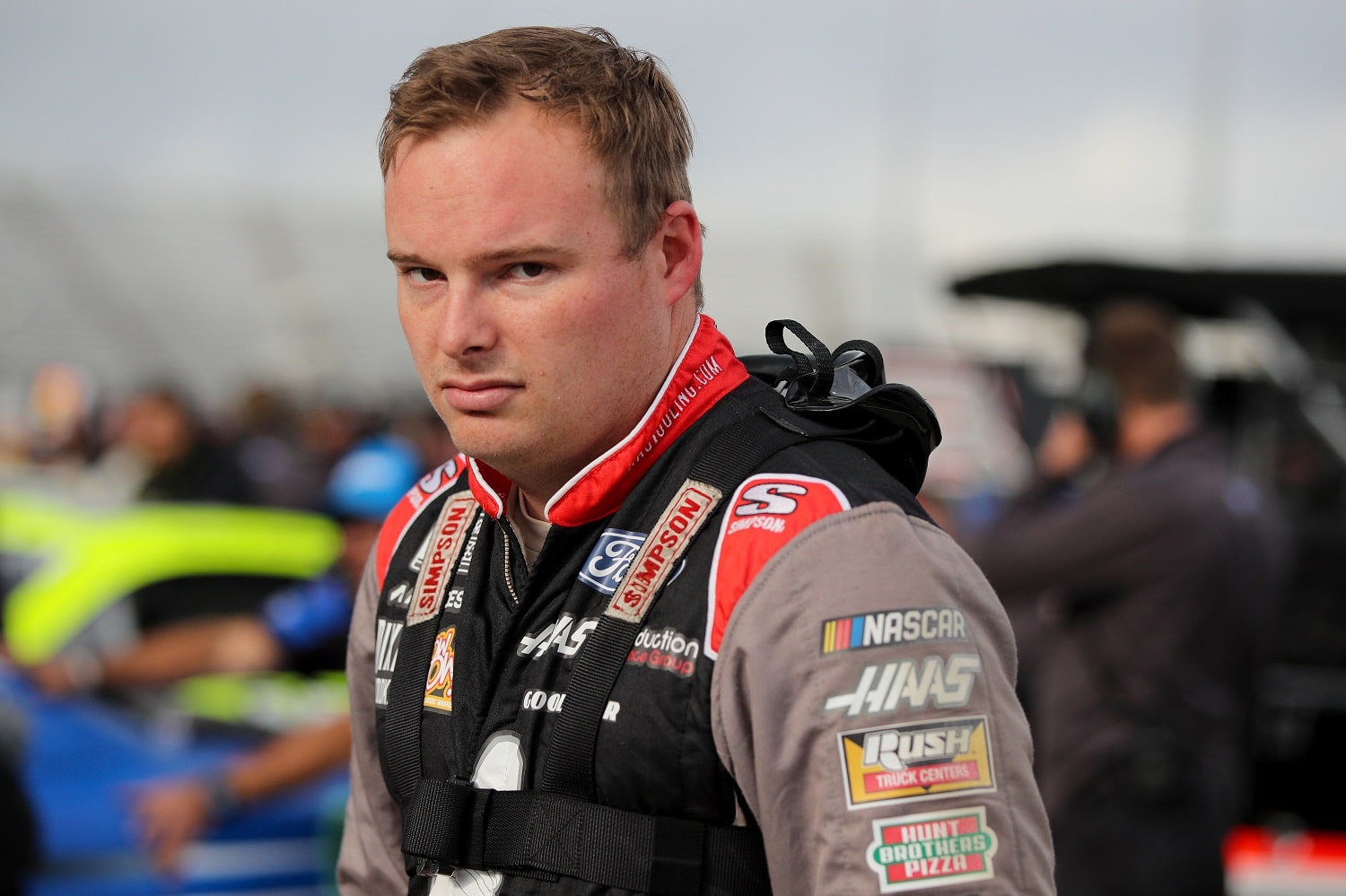 Cole Custer walks the grid during qualifying for the NASCAR Cup Series Blue-Emu Maximum Pain Relief 400 at Martinsville Speedway on April 8, 2022. | Meg Oliphant/Getty Images