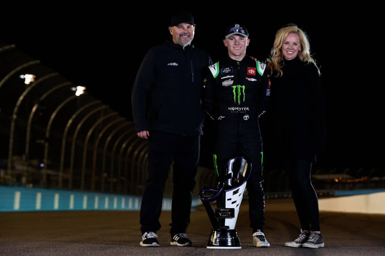 Coy Gibbs (L) poses with his son Ty (C) and wife Heather (R).