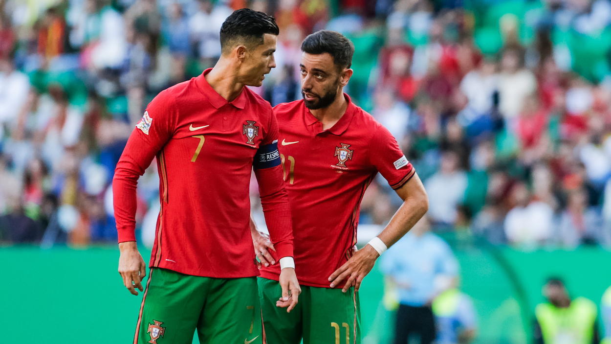 Manchester United and 2022 World Cup teammates Cristiano Ronaldo of Portugal (L) with Bruno Fernandes.