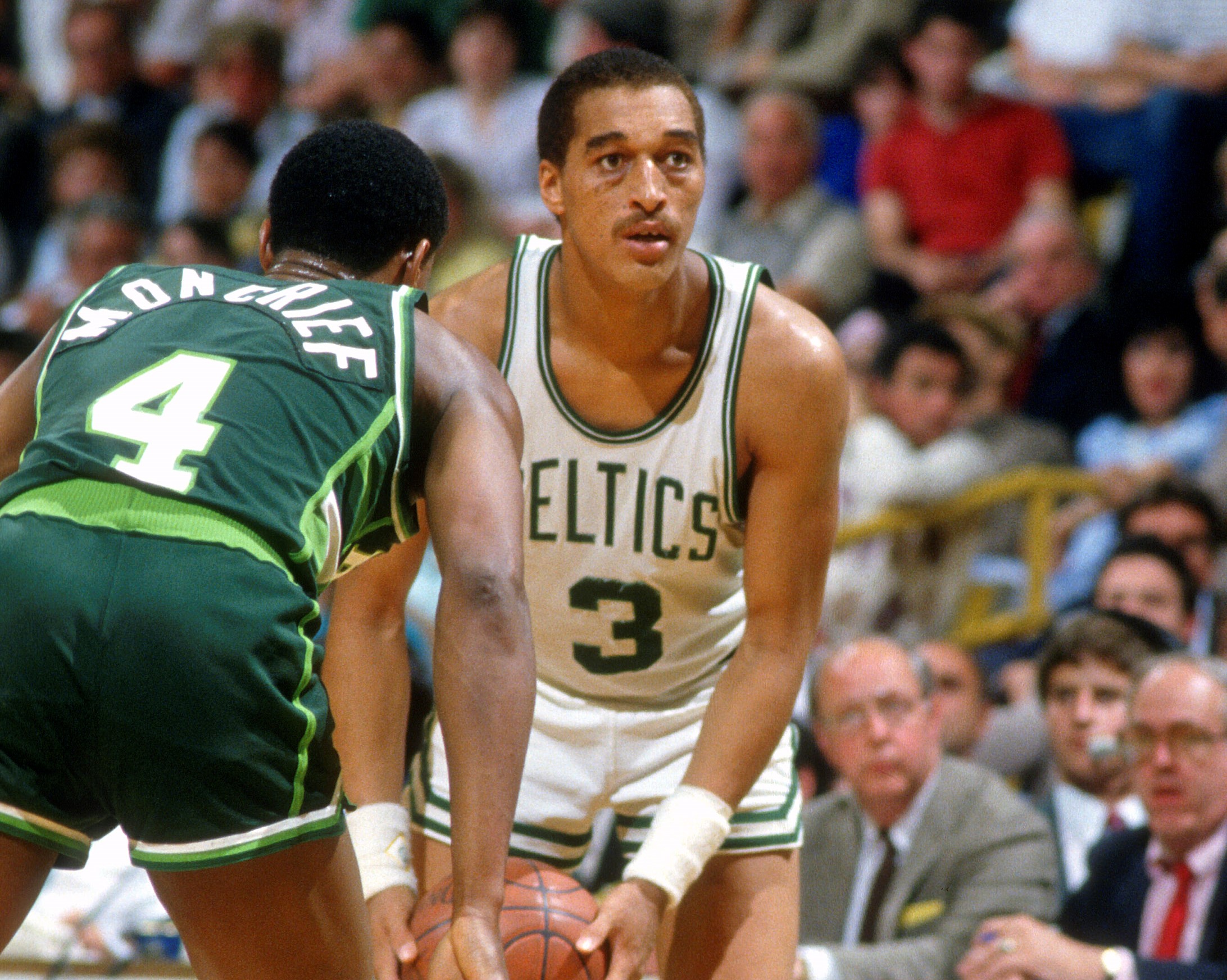 Dennis Johnson of the Boston Celtics looks to pass the ball against the Milwaukee Bucks.