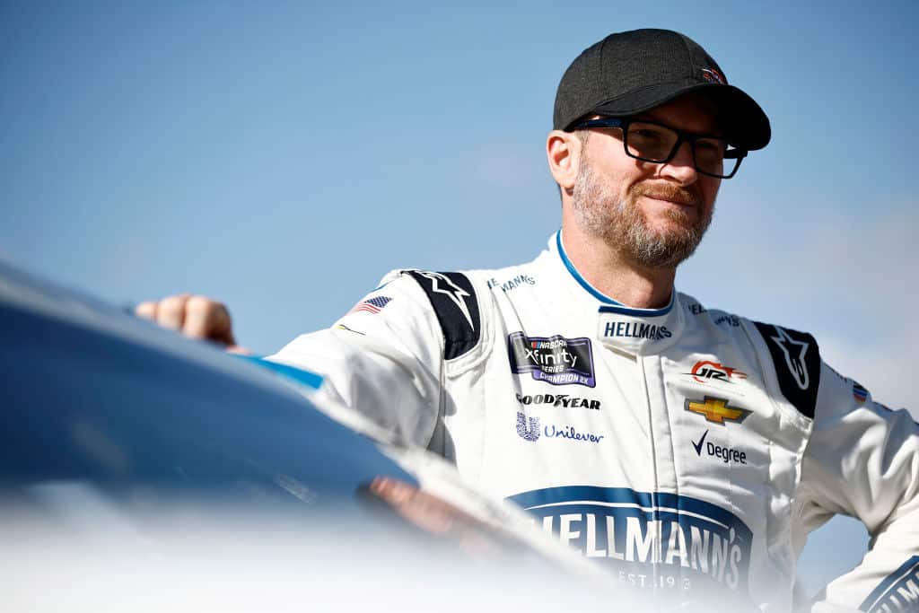 Dale Earnhardt Jr. stands next to his car during a NASCAR practice.