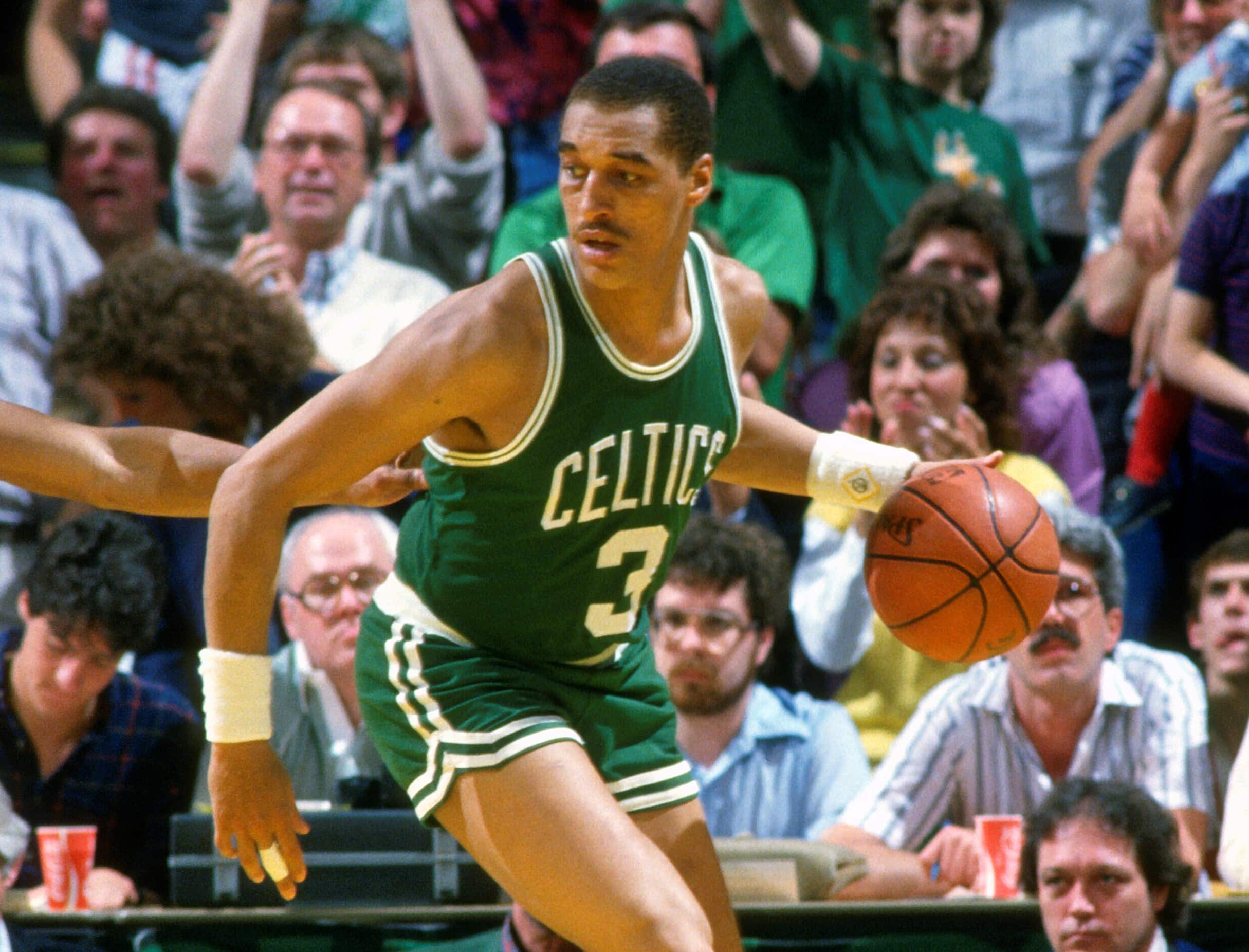 Dennis Johnson of the Boston Celtics dribbles the ball against the Milwaukee Bucks.