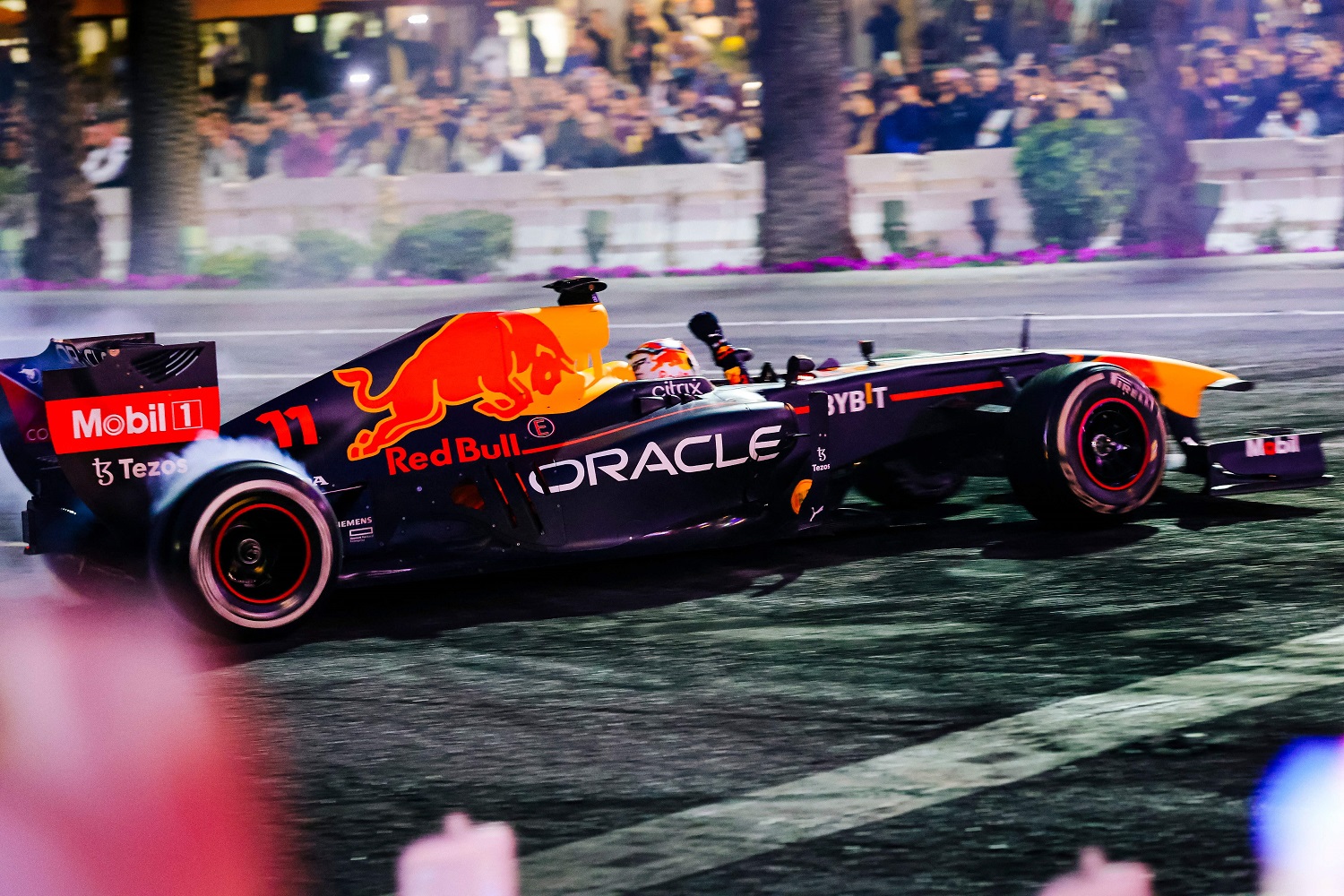 A Formula 1 racing team car from Oracle Red Bull Racing burns out on the Las Vegas Strip during the Las Vegas Grand Prix launch party on Nov. 5, 2022.