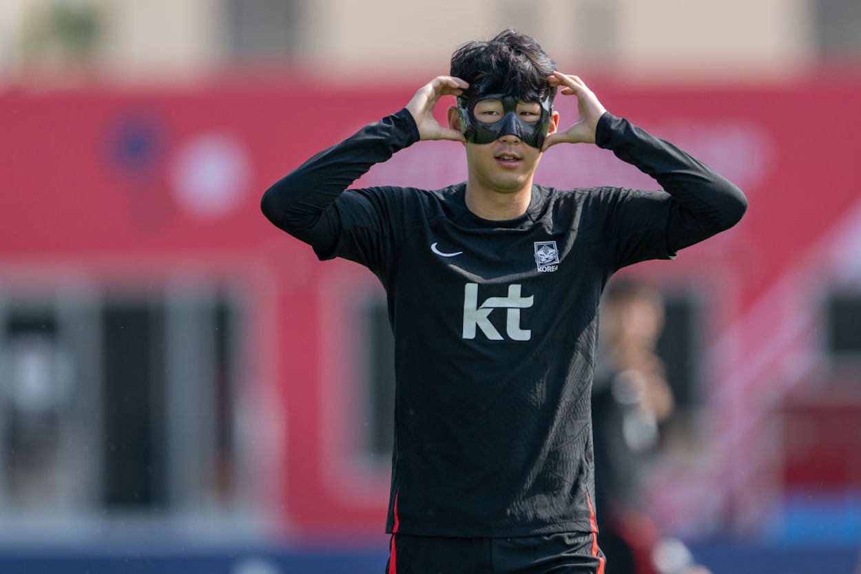 Heung-min Son puts on a protective mask during South Korea training.