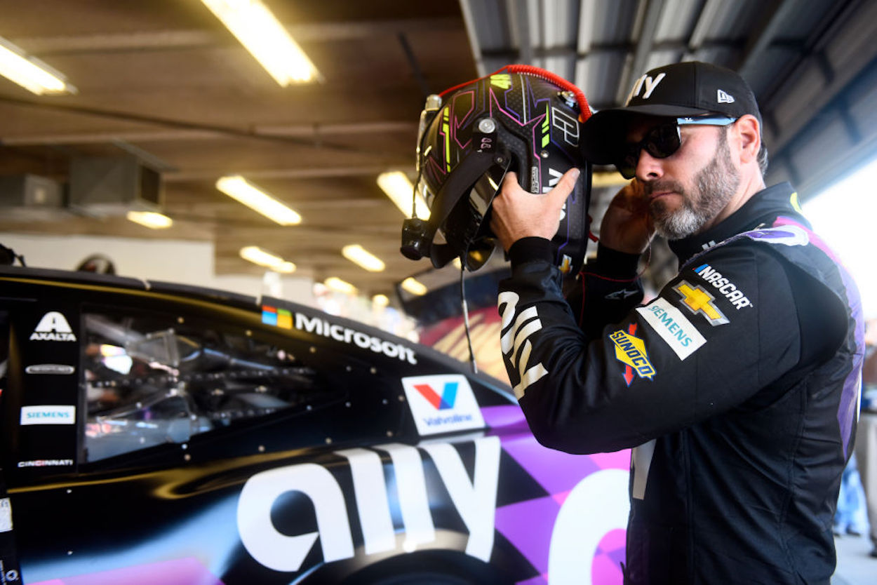 Jimmie Johnson gets ready to enter his car ahead of a 2020 race.