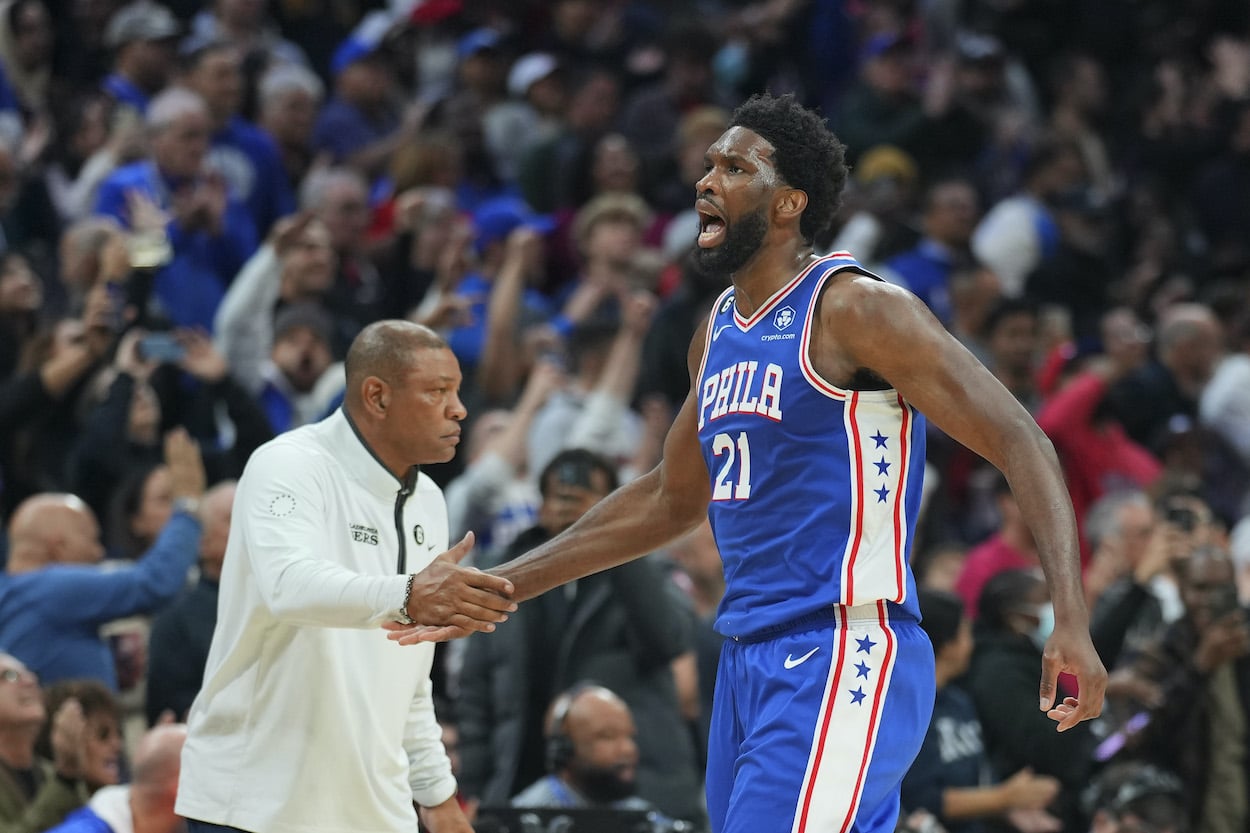 Joel Embiid celebrates against the Hawks.