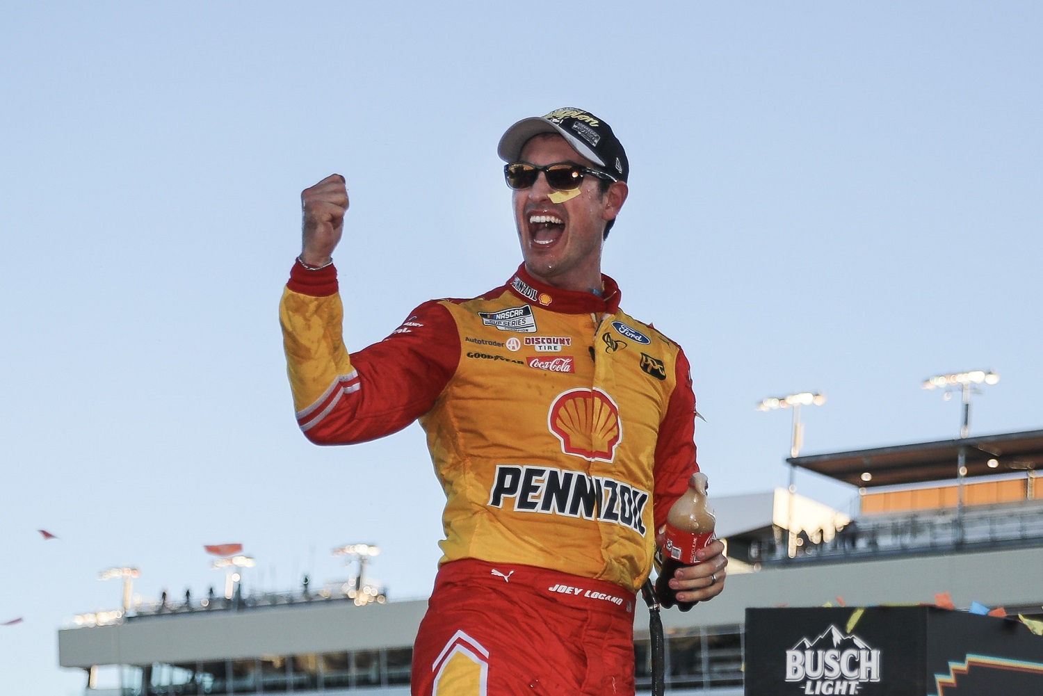 Joey Logano celebrates after winning the 2022 NASCAR Cup Series championship at Phoenix Raceway on Nov. 6, 2022.