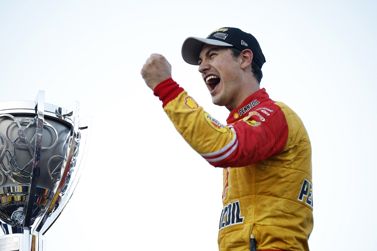 Joey Logano celebrates after winning the 2022 NASCAR Cup Series title