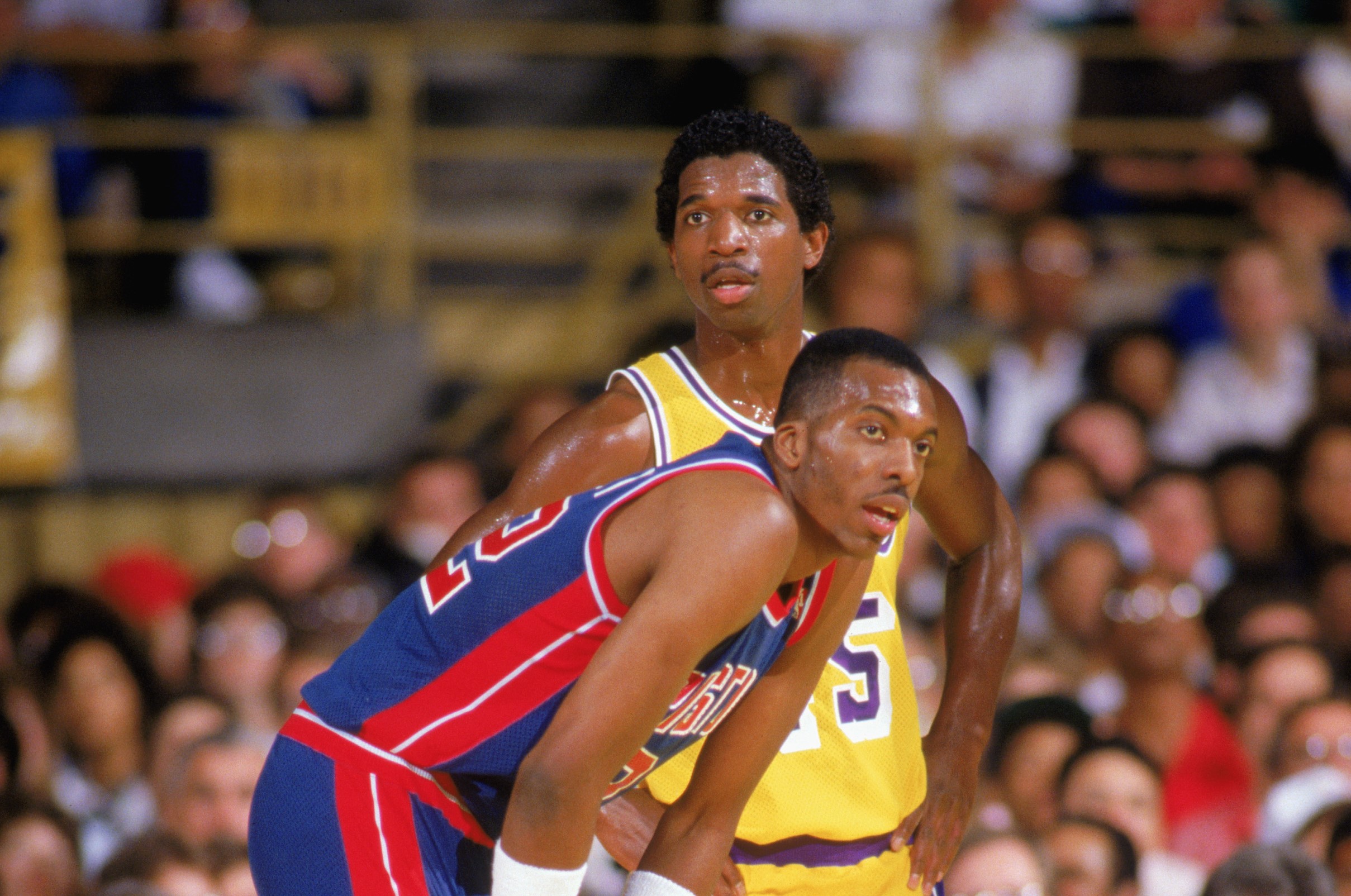 John Salley of the Detroit Pistons and A.C. Green of the Los Angeles Lakers wait for the free throw.