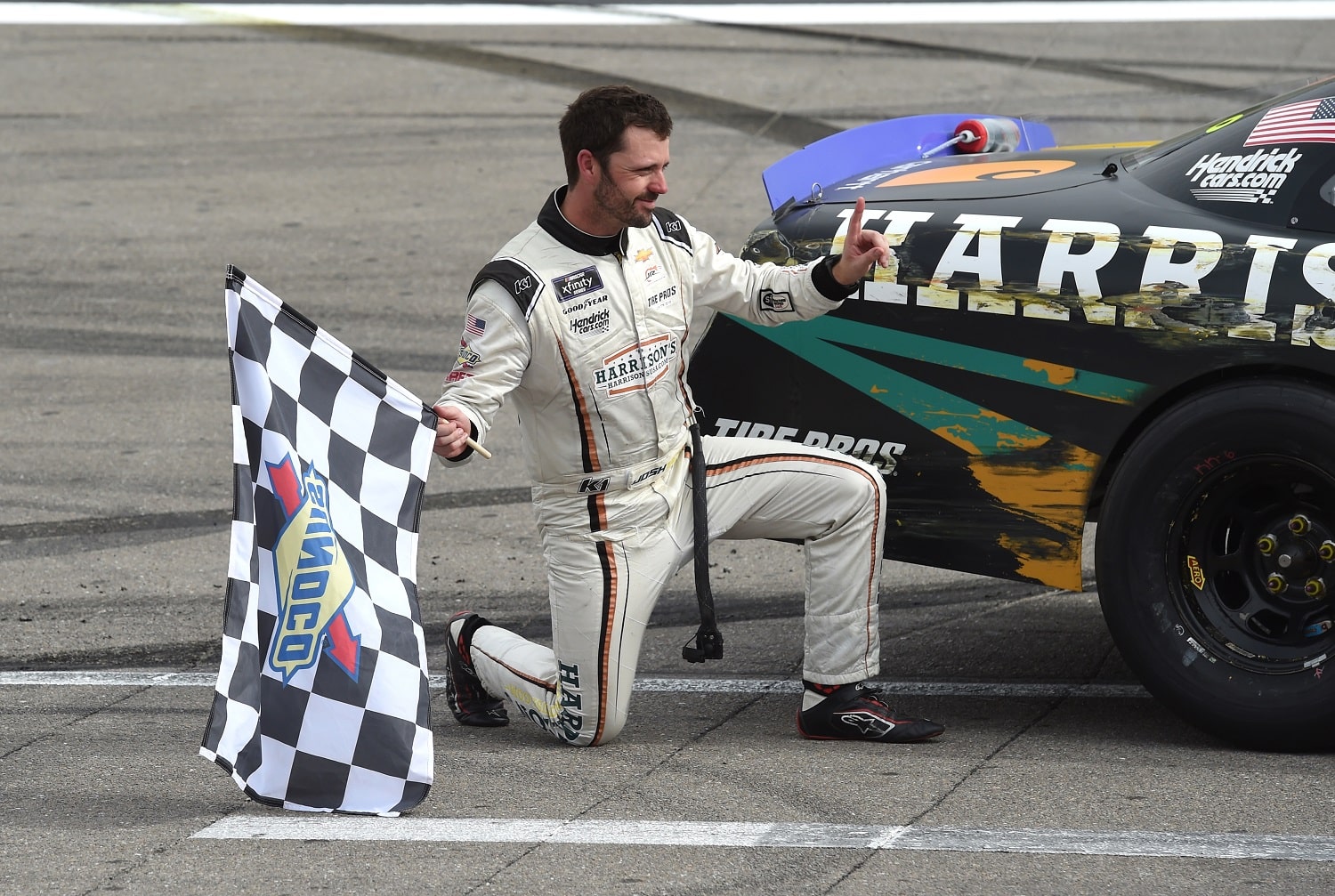 Josh Berry poses with his car after winning the NASCAR Xfinity Series Alsco Uniforms 302 on Oct. 15, 2022, at Las Vegas Motor Speedway.