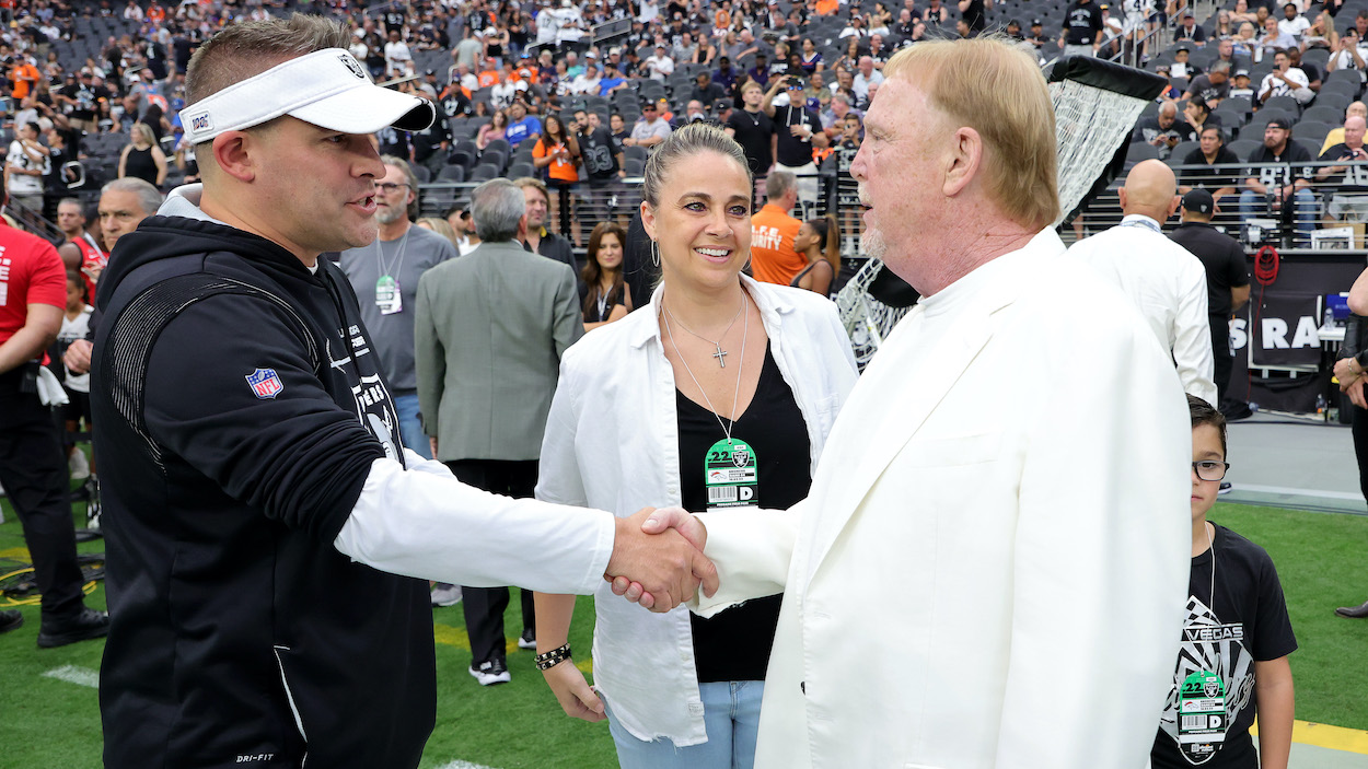 (L-R) Head coach Josh McDaniels of the Las Vegas Raiders, head coach Becky Hammon of the Las Vegas Aces and owner and managing general partner Mark Davis talk before a game.