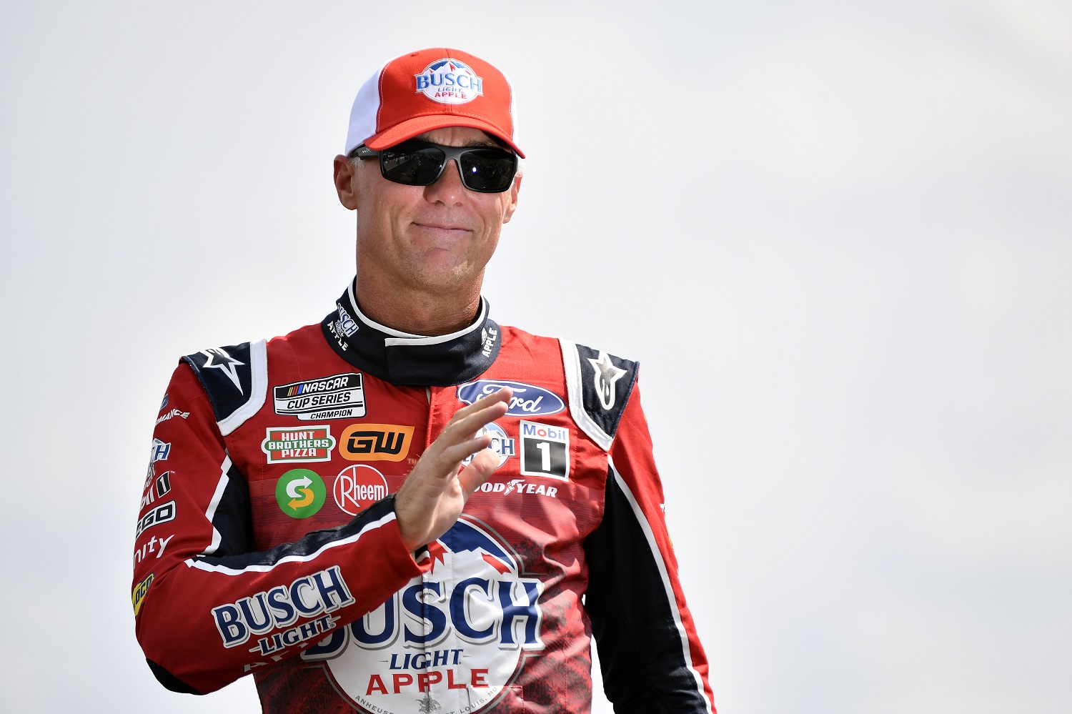 Kevin Harvick waves to fans onstage during driver intros prior to the NASCAR Cup Series Ally 400 at Nashville Superspeedway on June 26, 2022.