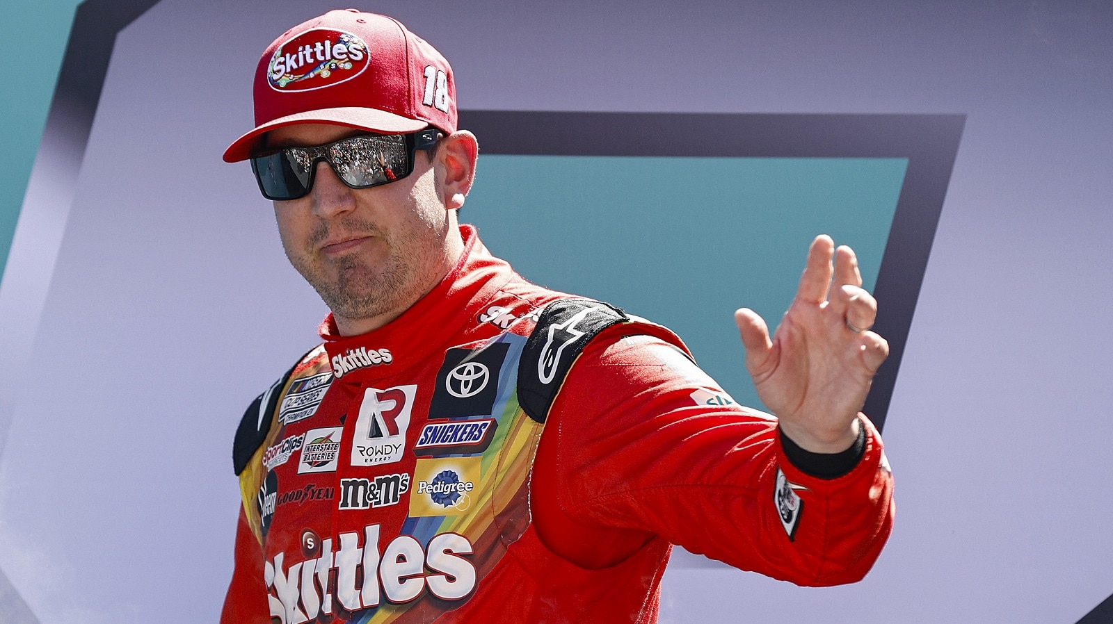 Kyle Busch waves to fans during driver intros prior to the NASCAR Cup Series Dixie Vodka 400 at Homestead-Miami Speedway on Oct. 23, 2022 in Homestead, Florida.