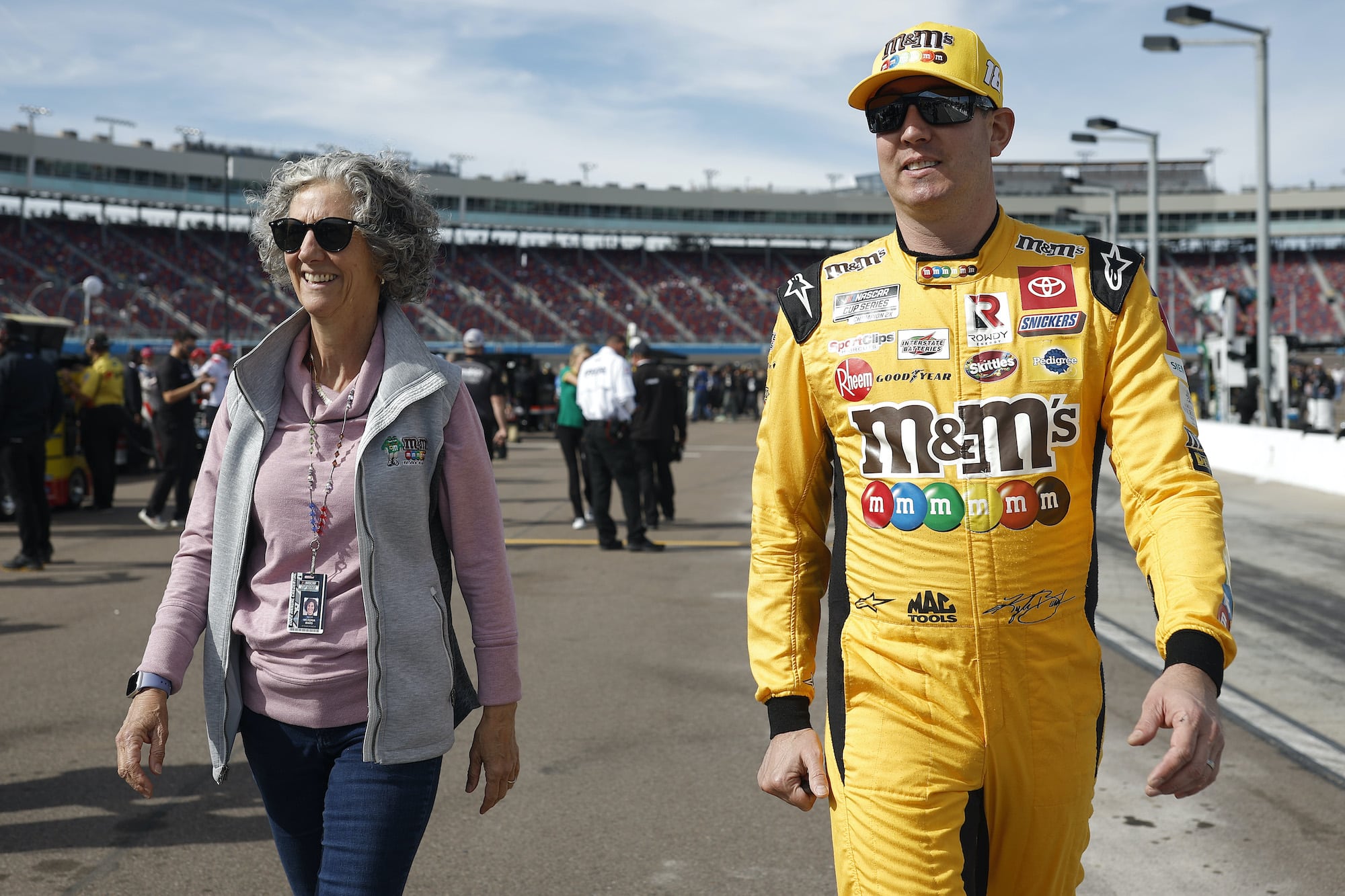 Kyle Busch walks with Victoria B. Mars