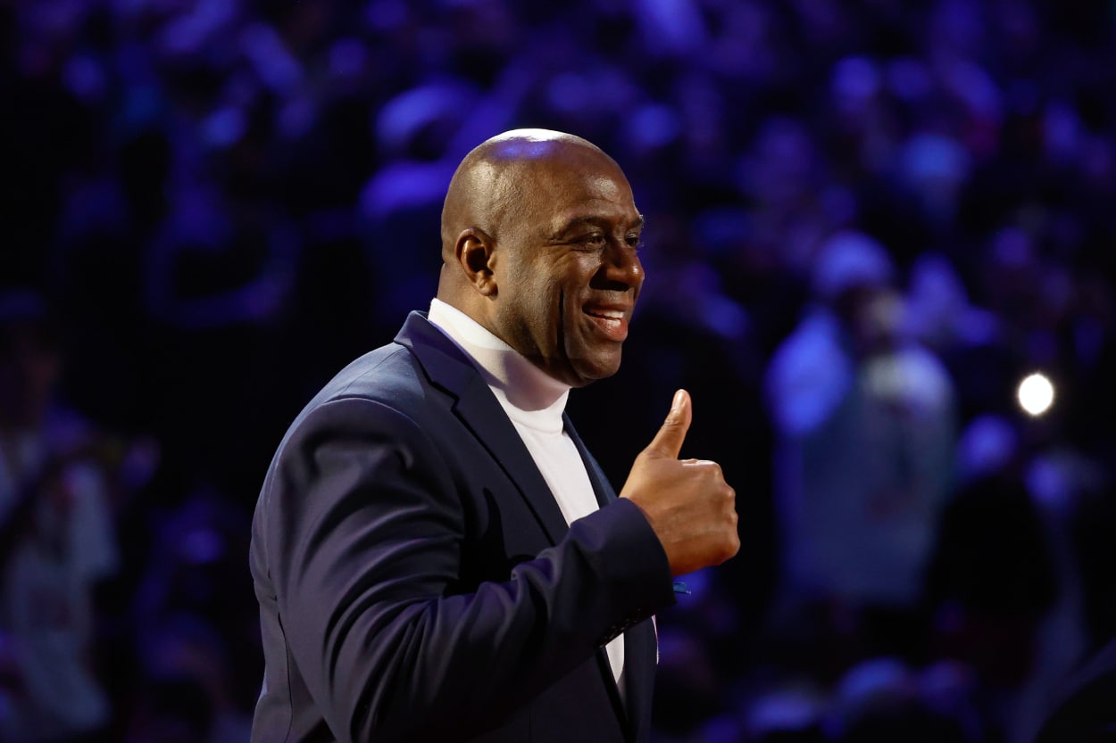 Earvin "Magic" Johnson reacts after being introduced as part of the NBA 75th Anniversary Team.