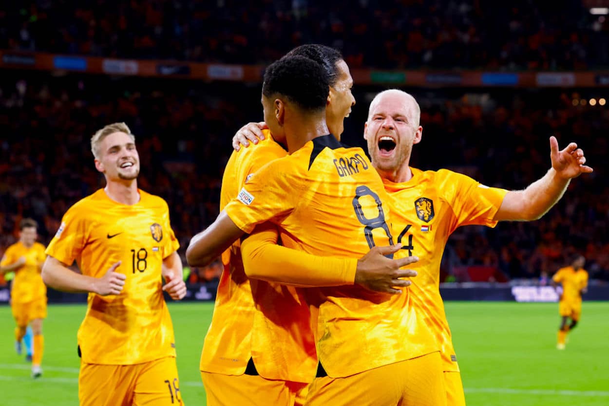 Dutch players Virgil van Dijk, Cody Gakpo, and Davy Klaassen celebrate a goal.