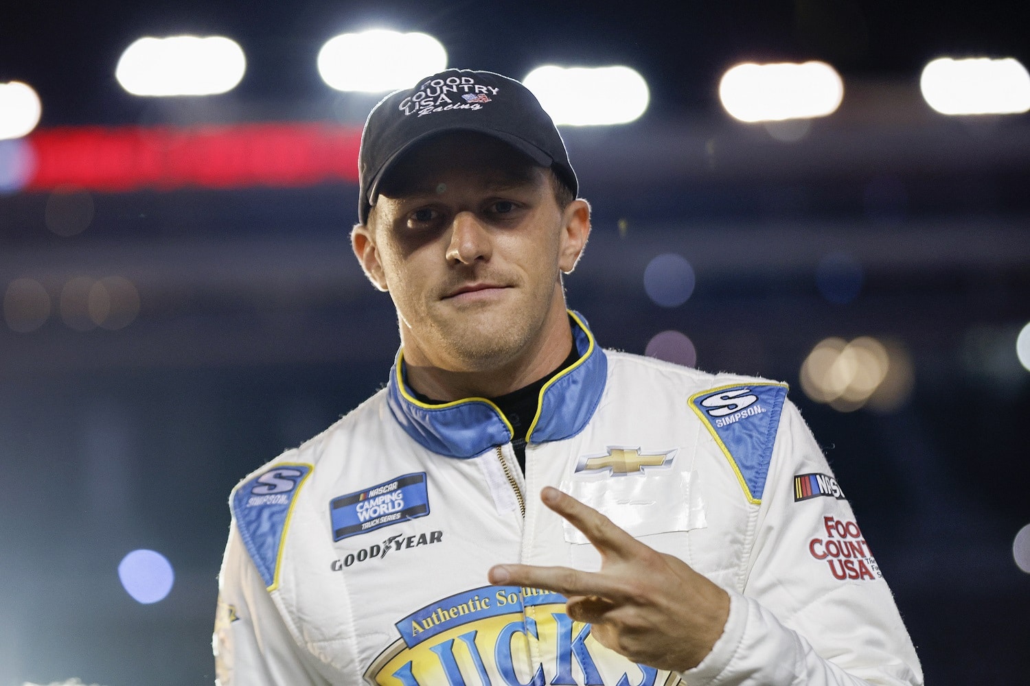 Parker Kligerman walks onstage during driver intros for the NASCAR Camping World Truck Series UNOH 200 at Bristol Motor Speedway on Sept. 15, 2022.