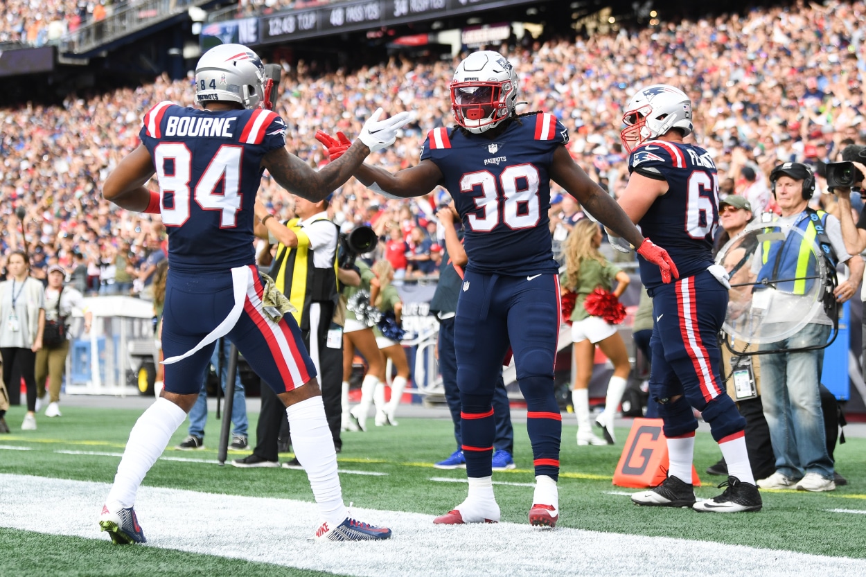 Rhamondre Stevenson celebrates with Kendrick Bourne of the New England Patriots.