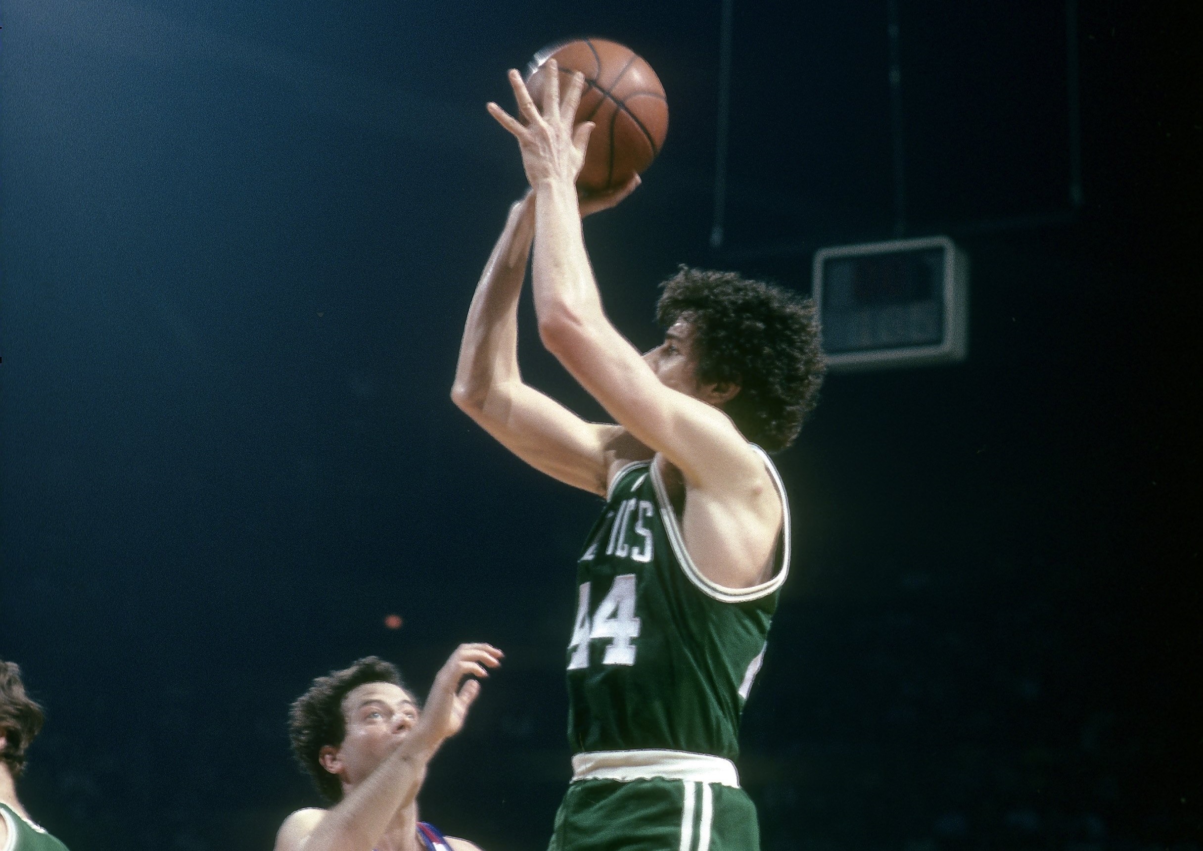 Pete Maravich of the Boston Celtics shoots over Kevin Grevey of the Washington Bullets.