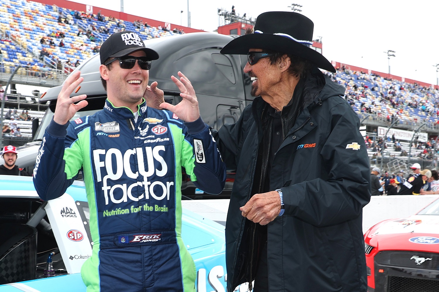 NASCAR Hall of Famer and Petty GMS Motorsports team co-owner Richard Petty and Erik Jones, driver of the No. 43 Chevy talk on the grid prior to the NASCAR Cup Series Goodyear 400 at Darlington Raceway on May 8, 2022.