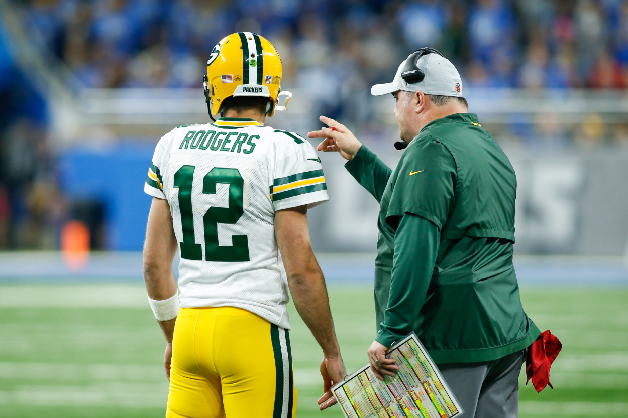 Green Bay Packers quarterback Aaron Rodgers (12) talks with Green Bay Packers heand coach Mike McCarthy.