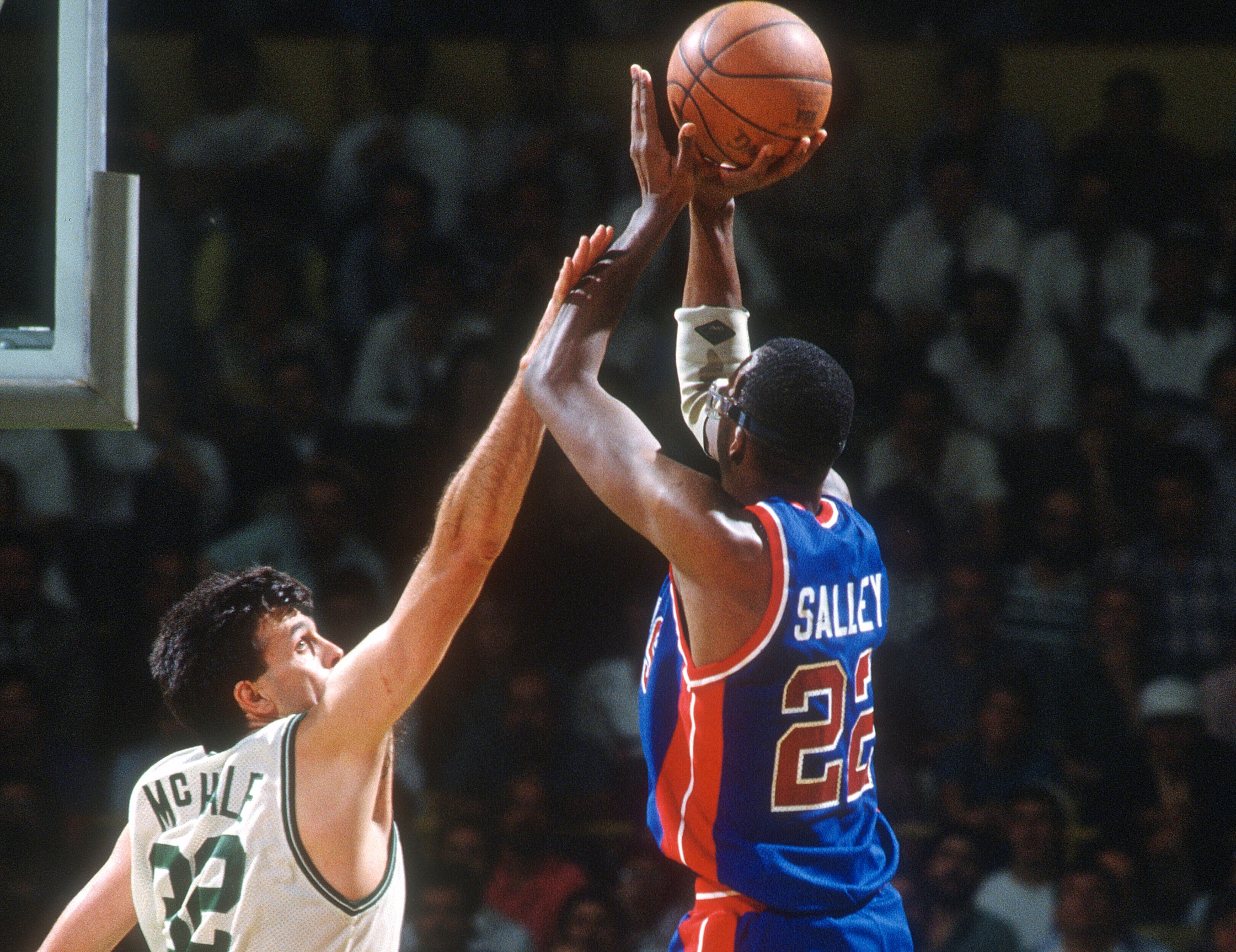 Kevin McHale of the Boston Celtics defends the shot of John Salley of the Detroit Pistons.