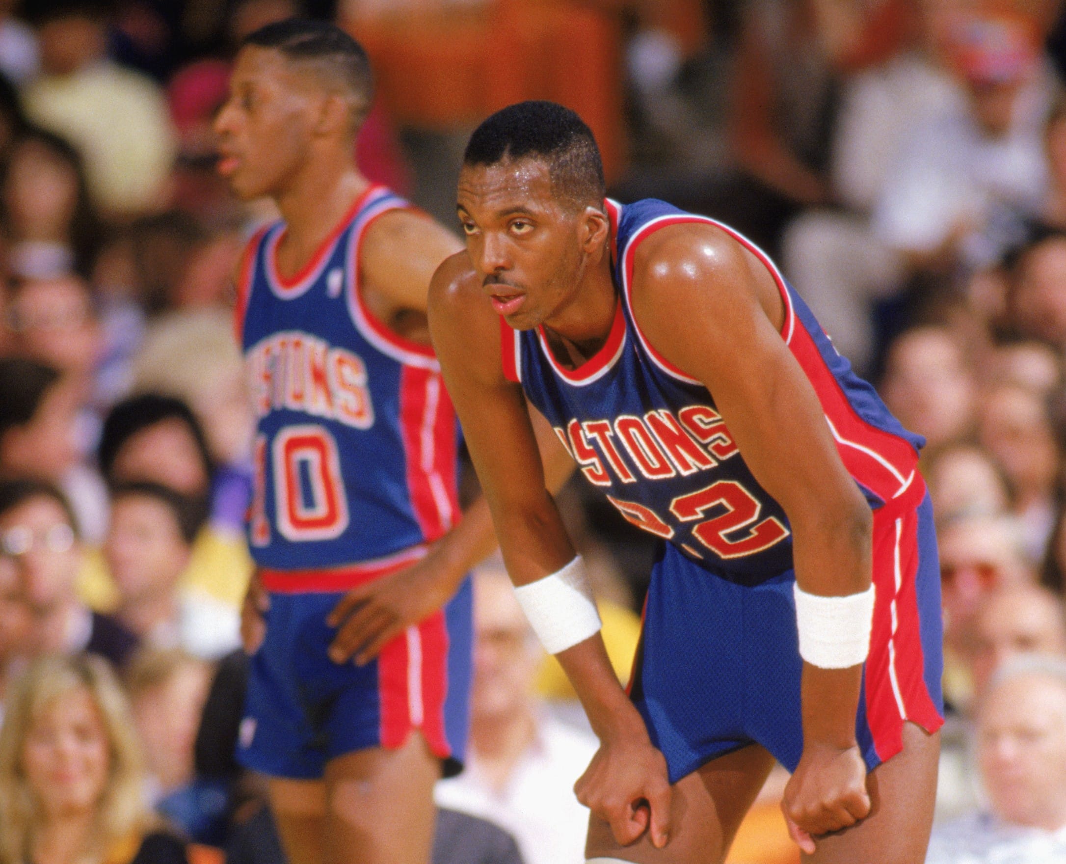 John Salley of the Detroit Pistons looks on.